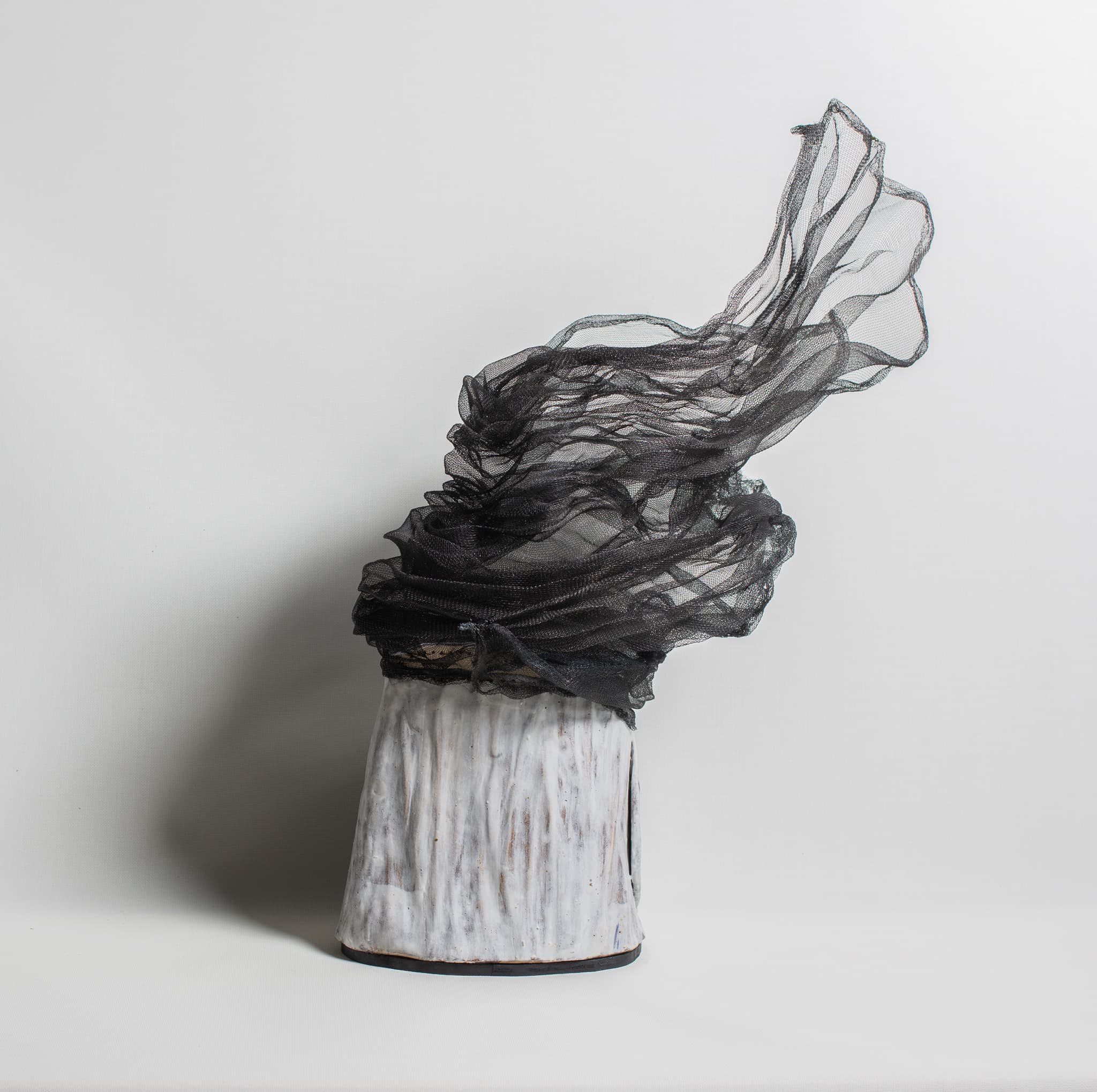 Dancing light by J9 Stanton, earthenware and wire mesh sculpture.